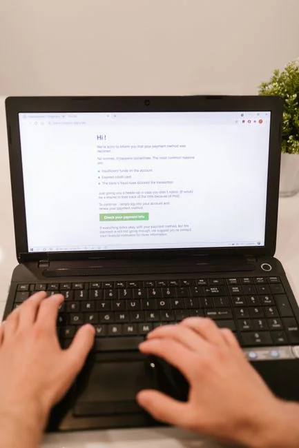 Person analyzing cryptocurrency data using a laptop, highlighting financial insights.